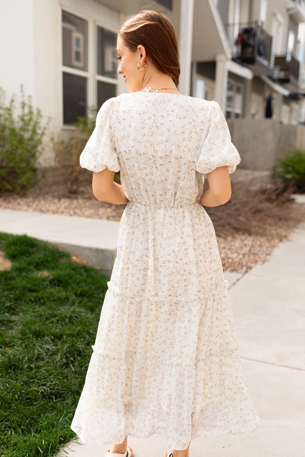 Back view of the dusty blue floral dress