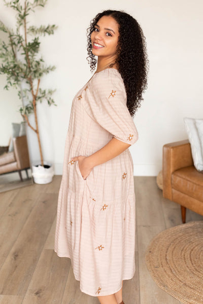 Side view of the natural embroidered floral dress