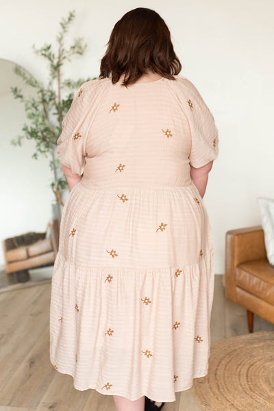 Back view of the natural embroidered floral dress in plus size