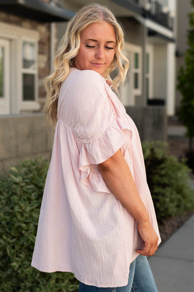 Side view of a blush top