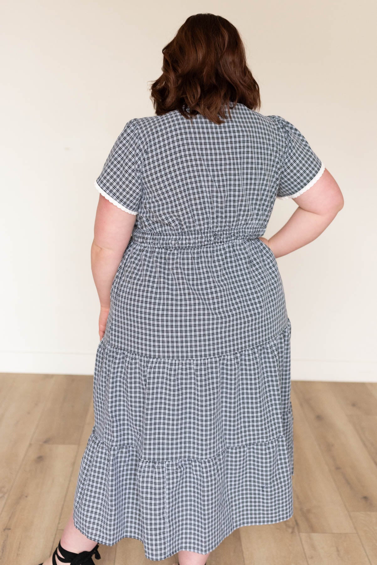 Back view of the plus size black plaid dress in plus size