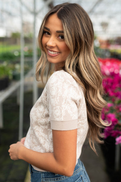 Side view of the taupe floral knit top