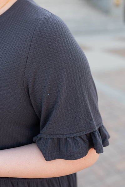 Close up of the sleeve on the charcoal rib knit dress