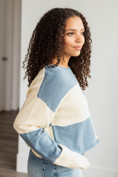 Side view of the blue checkered sweater