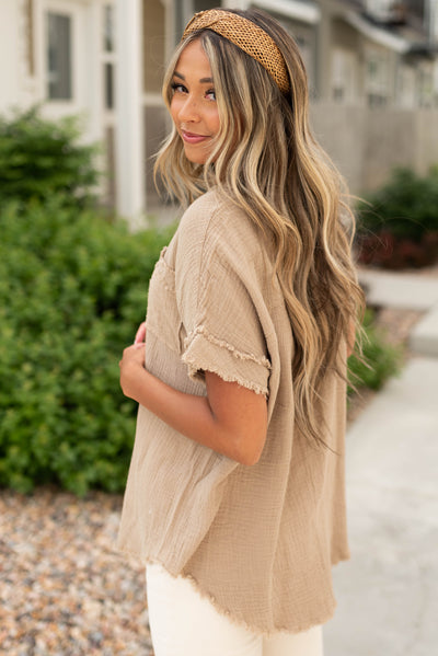 Side view of a short sleeve tan top