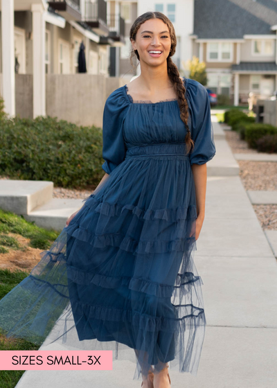 Navy long sleeve ruffle dress with ruffles on the skirt