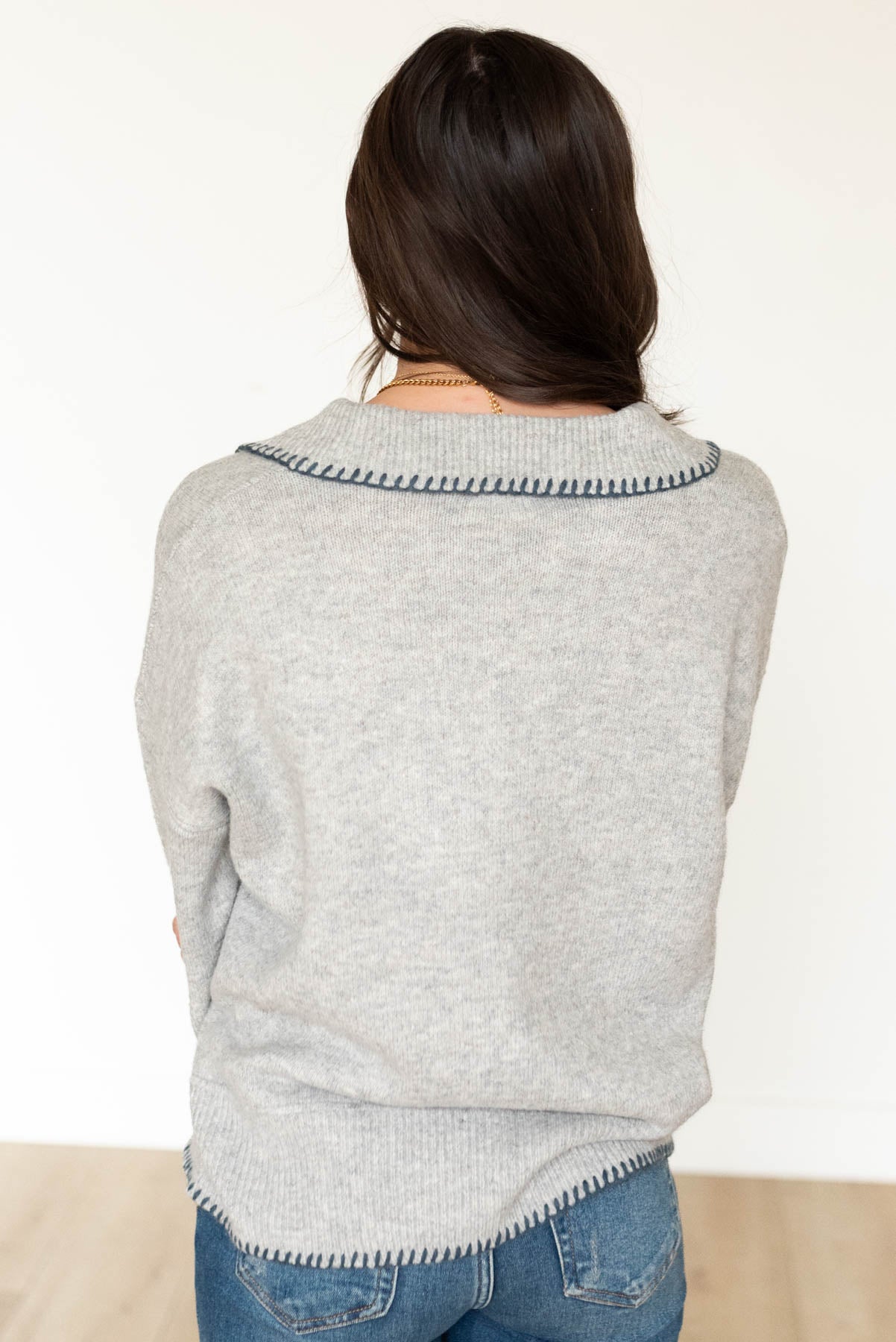 Back view of the navy stitched knit sweater