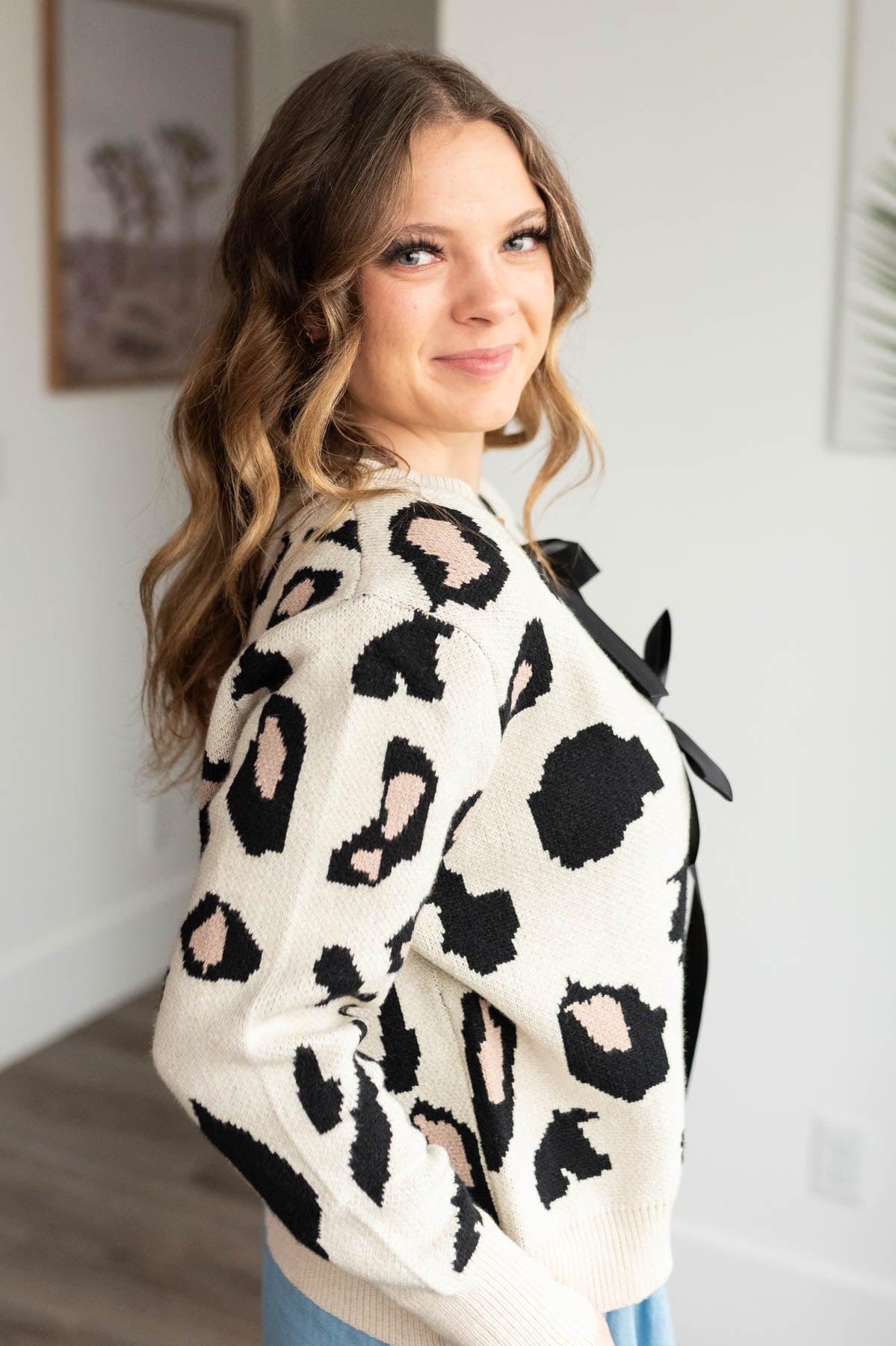 Side view of the cream leopard cardigan