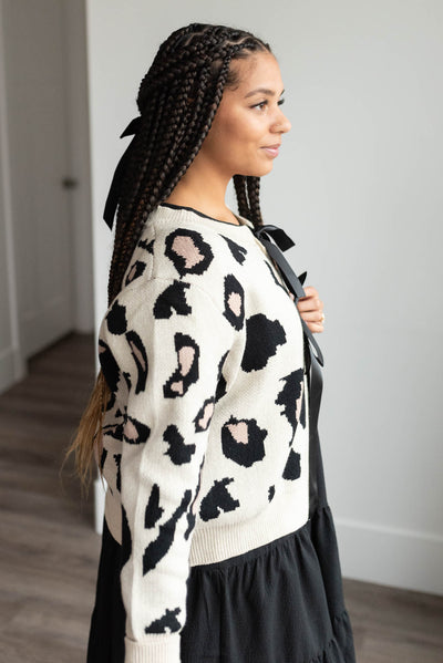 Side view of the cream leopard cardigan