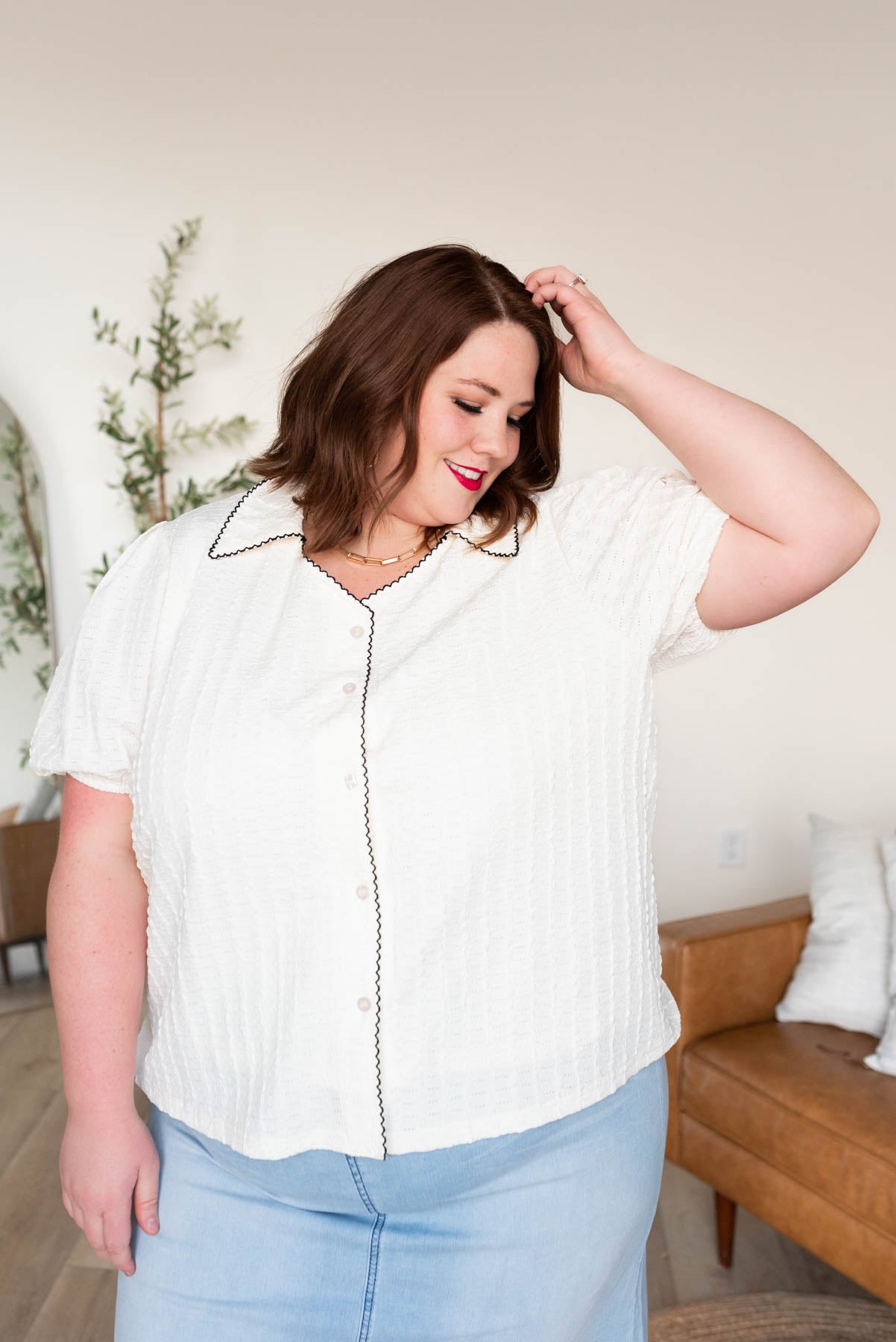 Button up cream collared top with black trim in plus size