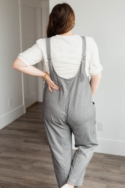 Back view of the plus size charcoal stripe overalls