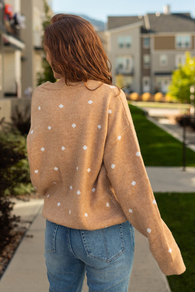 Back view of a camel sweater