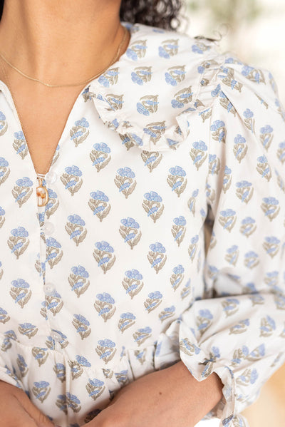 Close up of the collar on the blue floral dress