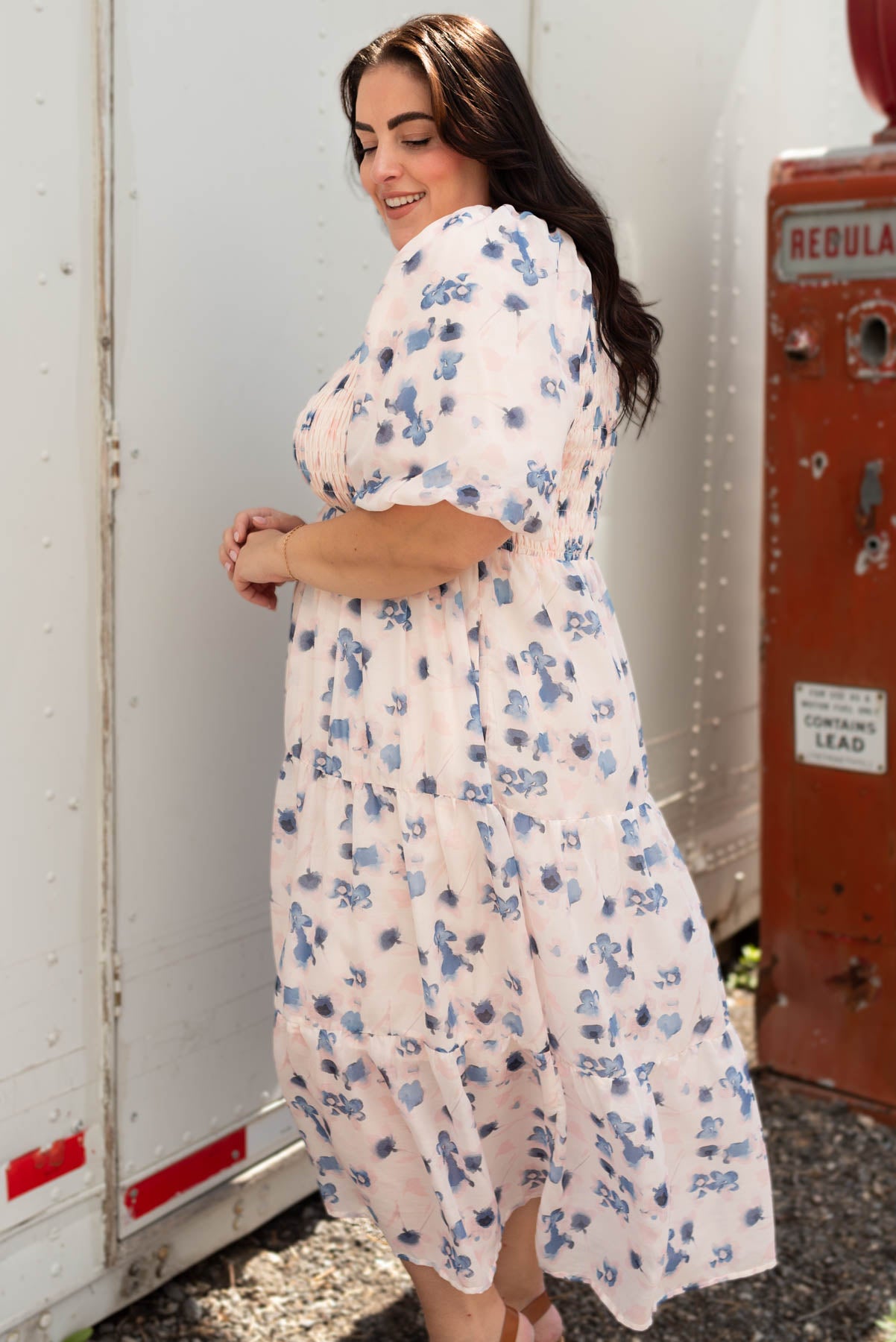 Side view of the plus size blue floral smocked dress