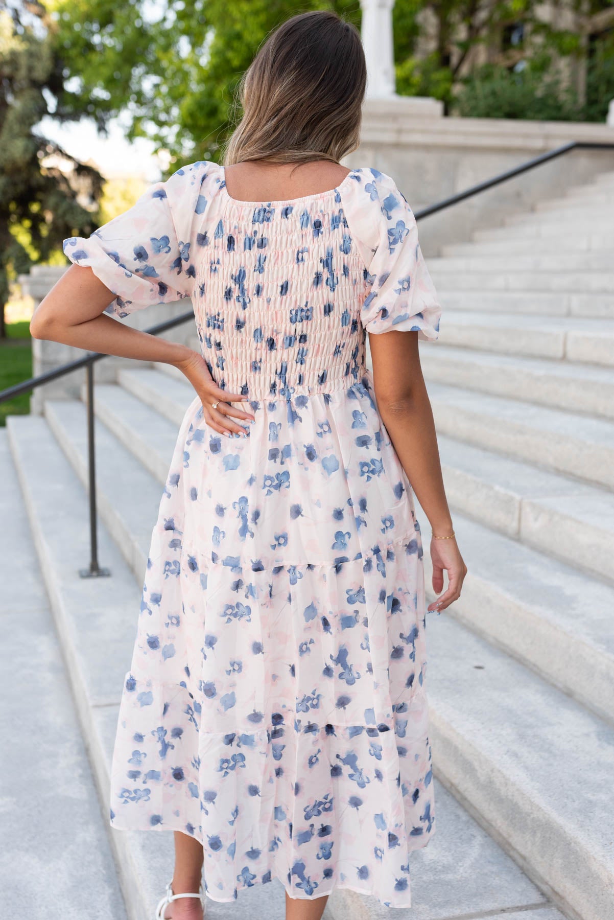 Back view of the blue floral smocked dress