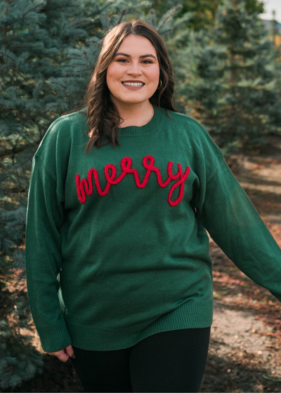 Plus size front view of the merry green crewneck sweater