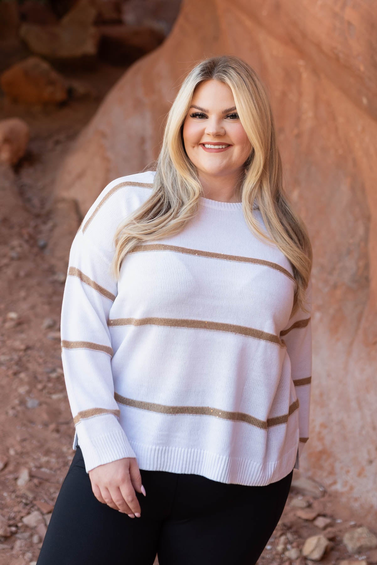 Long sleeve white sweater with stripes and a drop sleeve