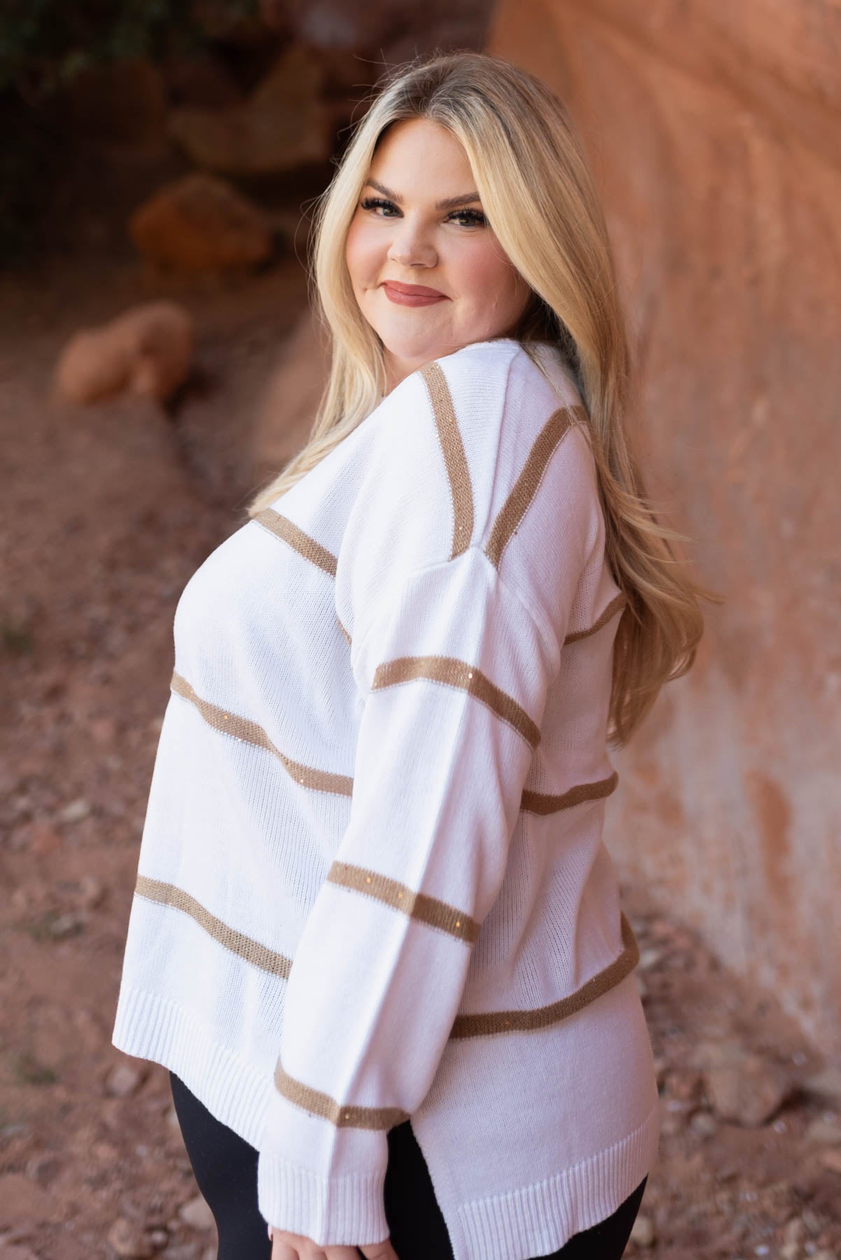 Side view of a white sweater