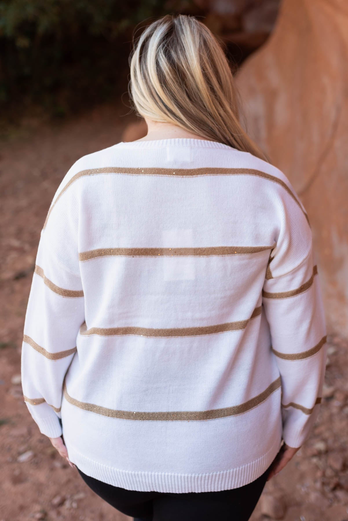 Back view of a white sweater