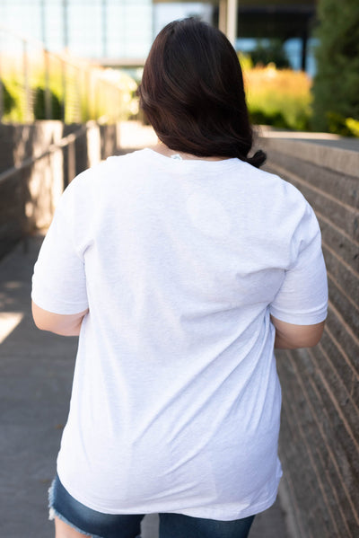 Back view of the ash grey floral grid top