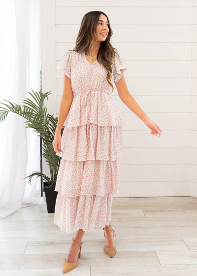 Blush rose tiered ruffle dress with lace trim on the sleeves