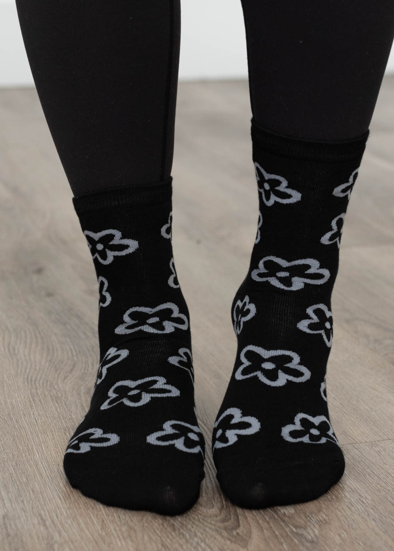 Front view of black flower socks