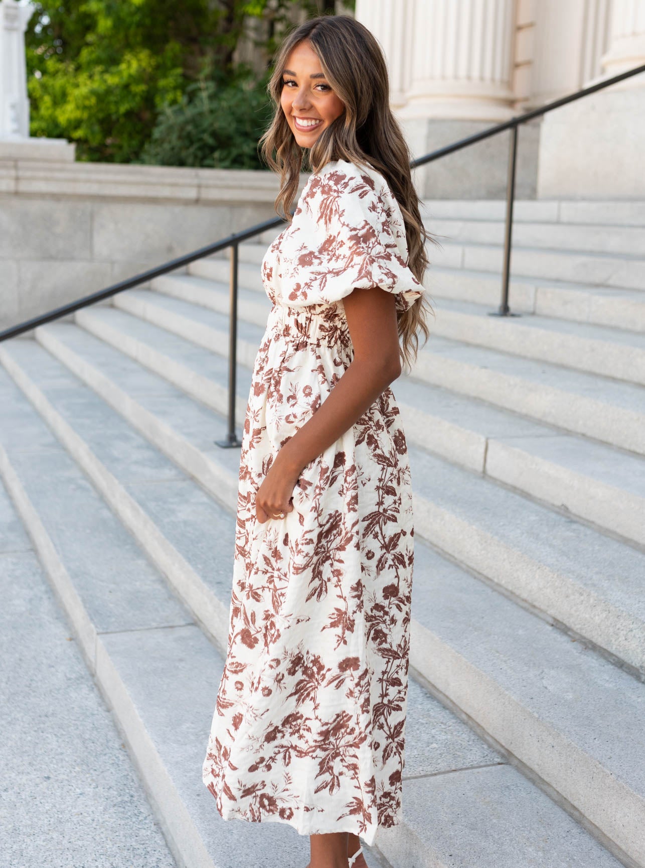 Side view of the mocha floral tiered dress with smocked bodice