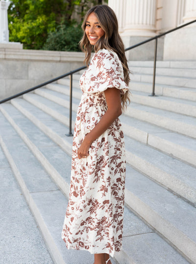 Side view of the mocha floral tiered dress with smocked bodice