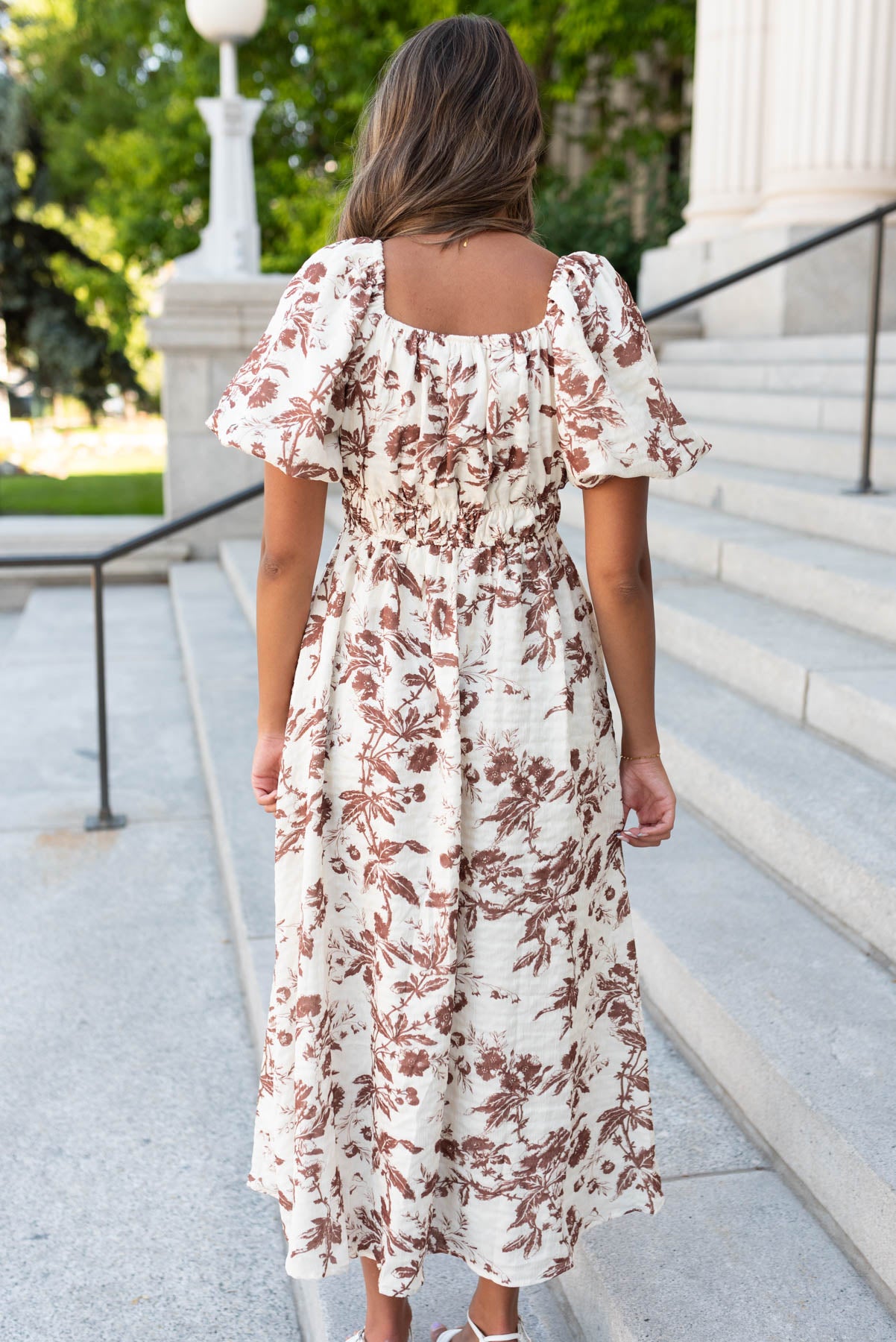 Back view of the mocha floral tiered dress