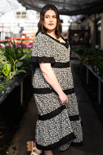 Side view of the plus size black floral dress