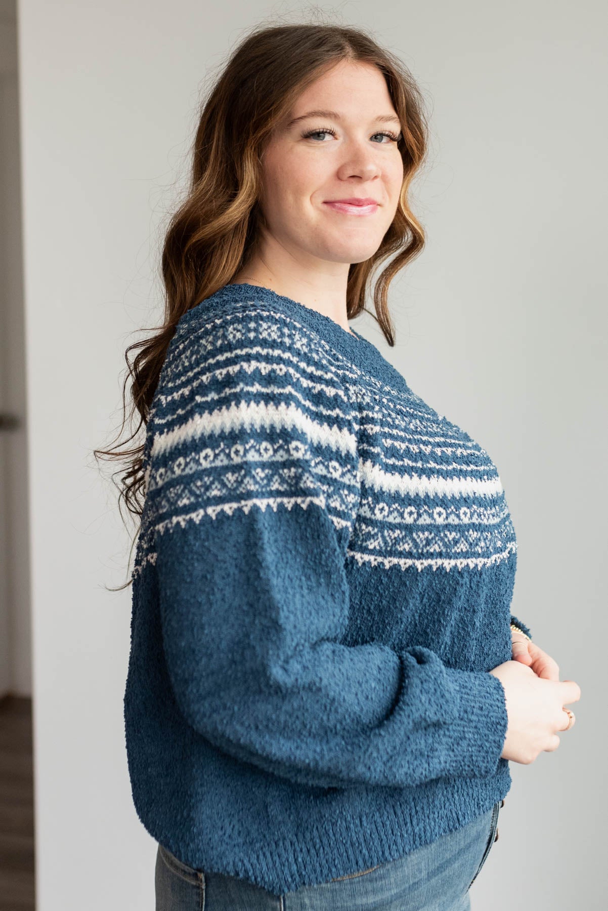 Side view of the plus size navy knit sweater