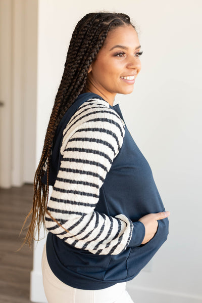 Side view of the navy stripe hooded top