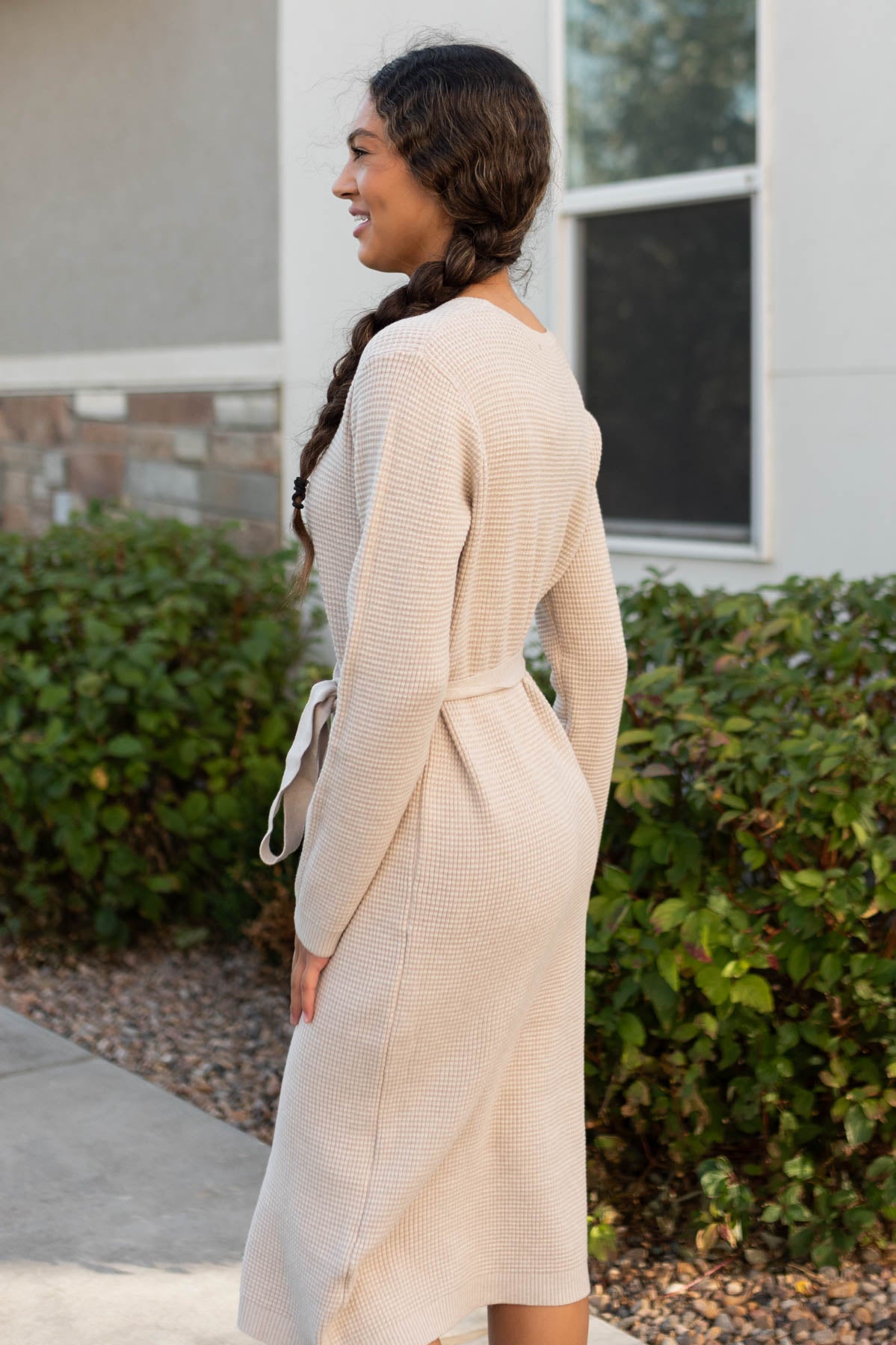 Side view of the stone waffle sweater dress