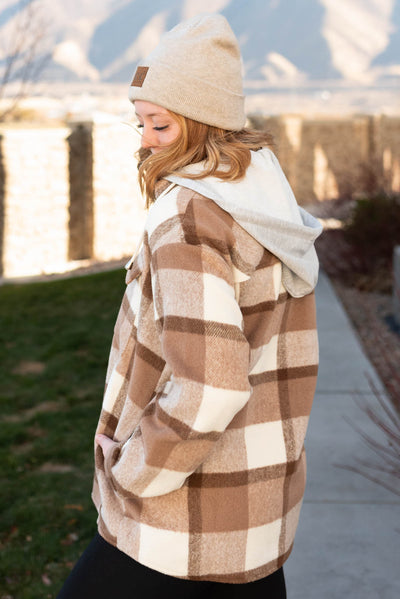 Side view of a taupe button down shacket