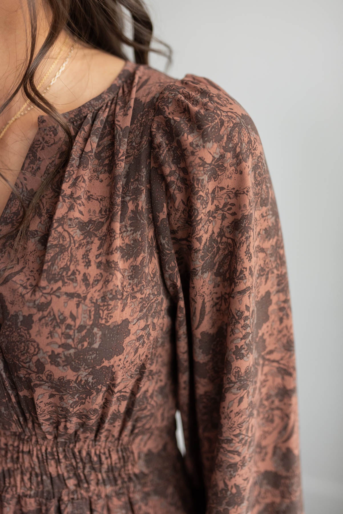 close up of the fabric on the mahogany floral tiered dress