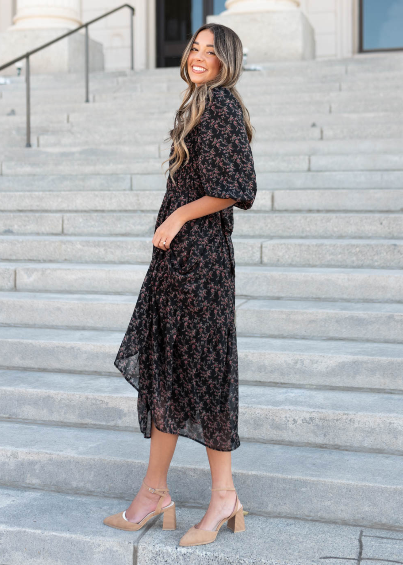 Side view of the short sleeve black pink flower dress