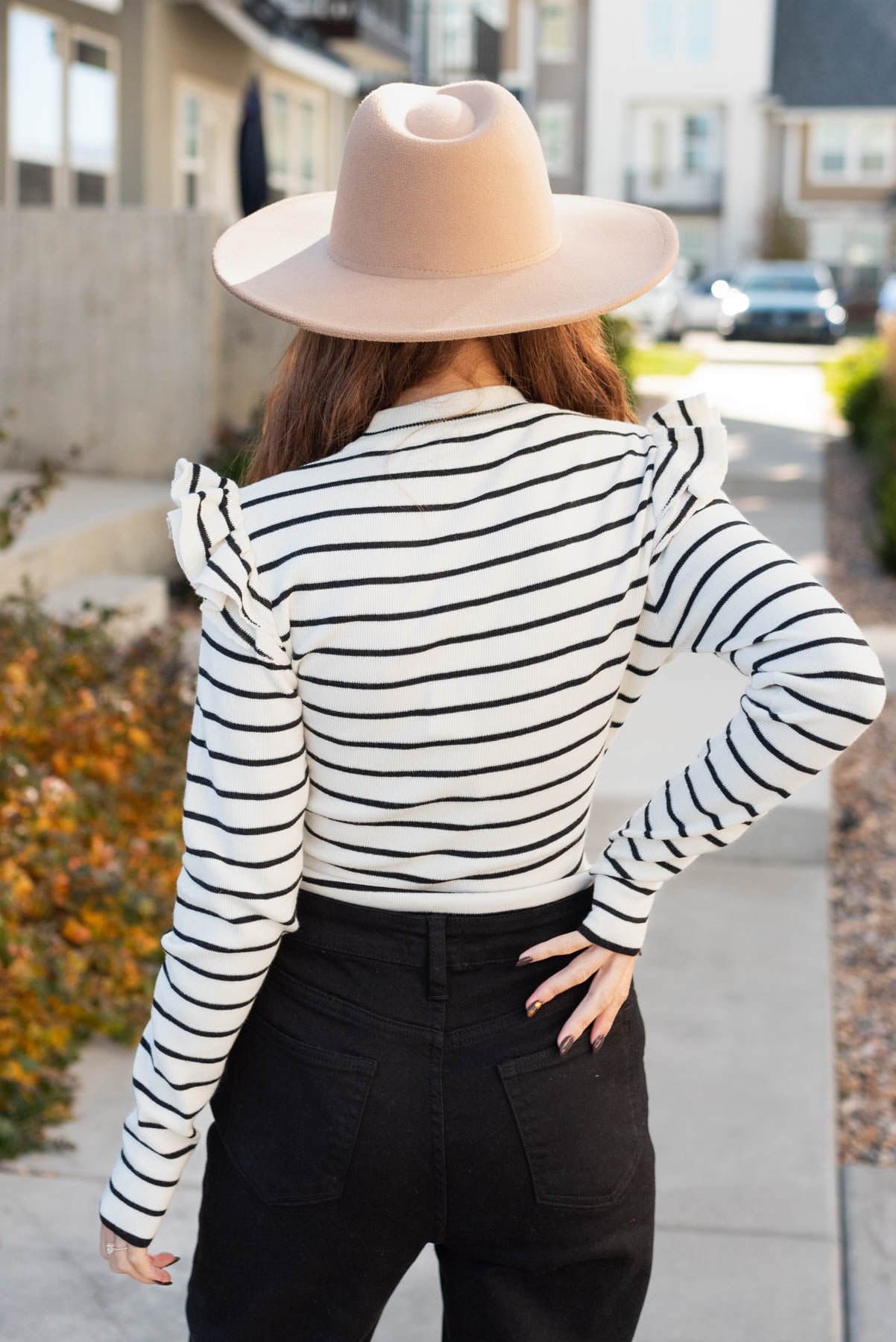 Back view of the cream stripe bodysuit