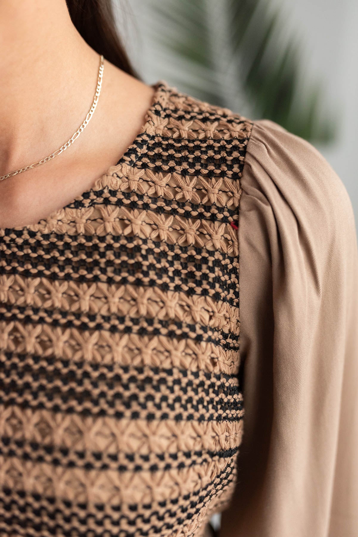 close up of the mocha crochet stripe top