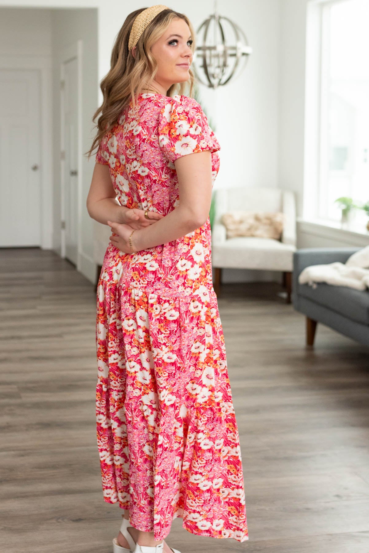 Side view of a fuchsia floral dress