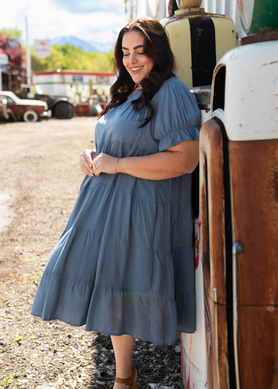 Side view of the plus size navy tiered dress