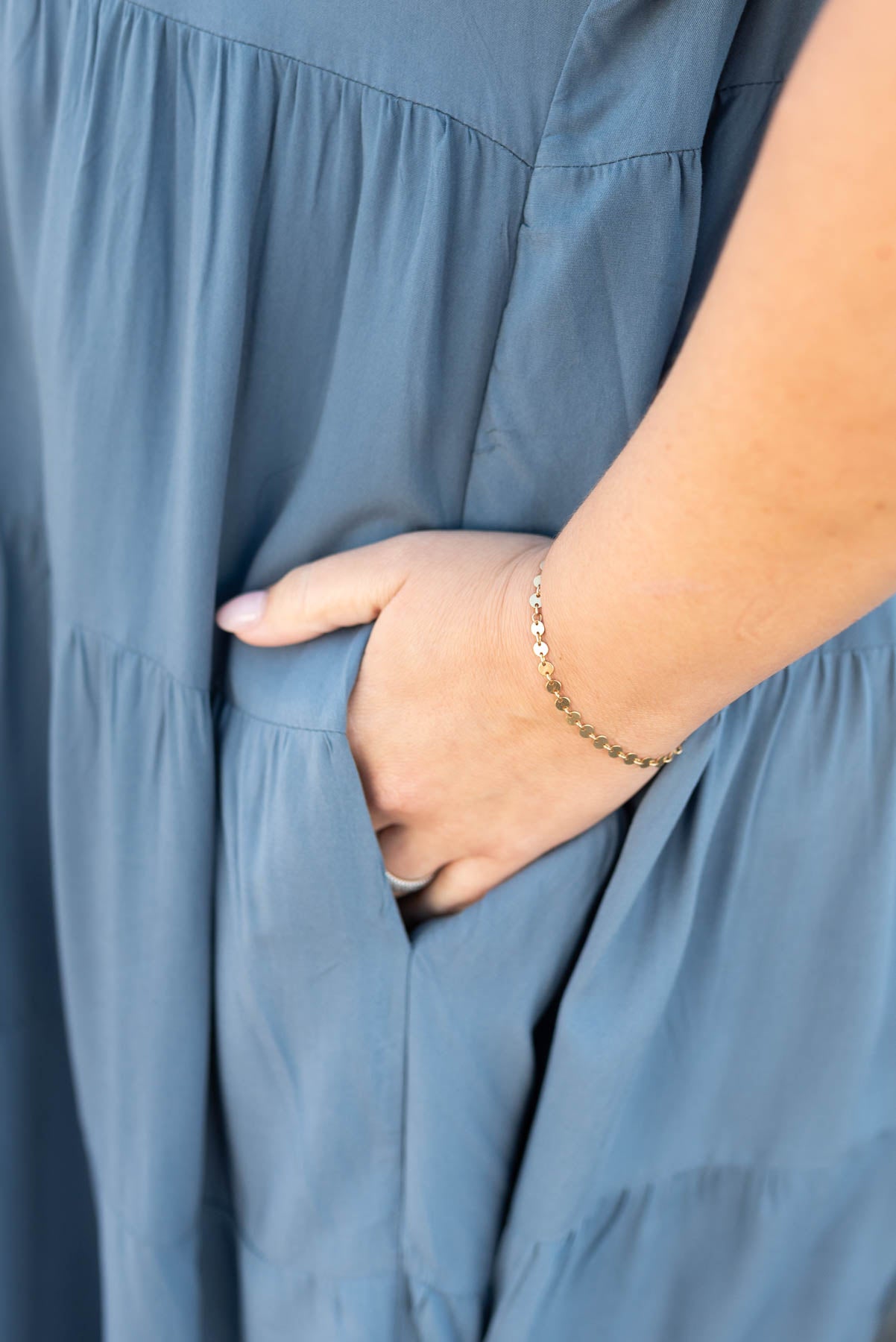 Close up of the pockets and fabric on the navy tiered dress