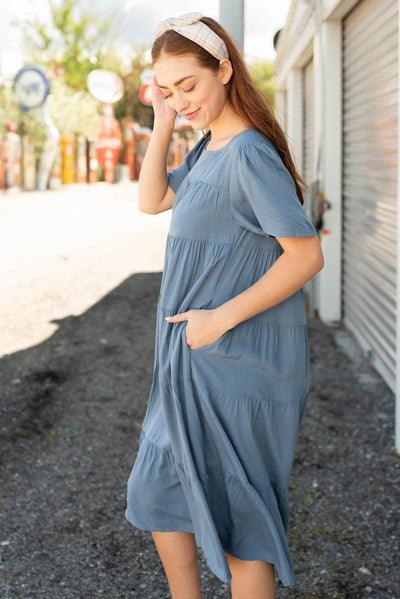 Side view of the navy tiered dress