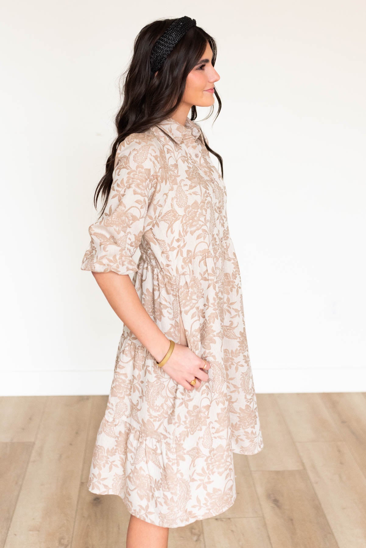 Side view of the taupe floral button down dress