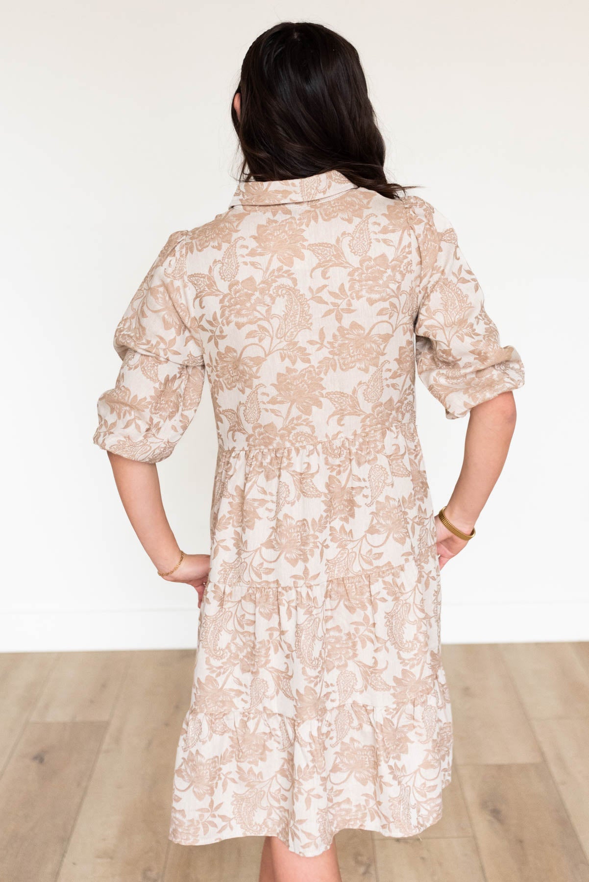 Back view of the taupe floral button down dress