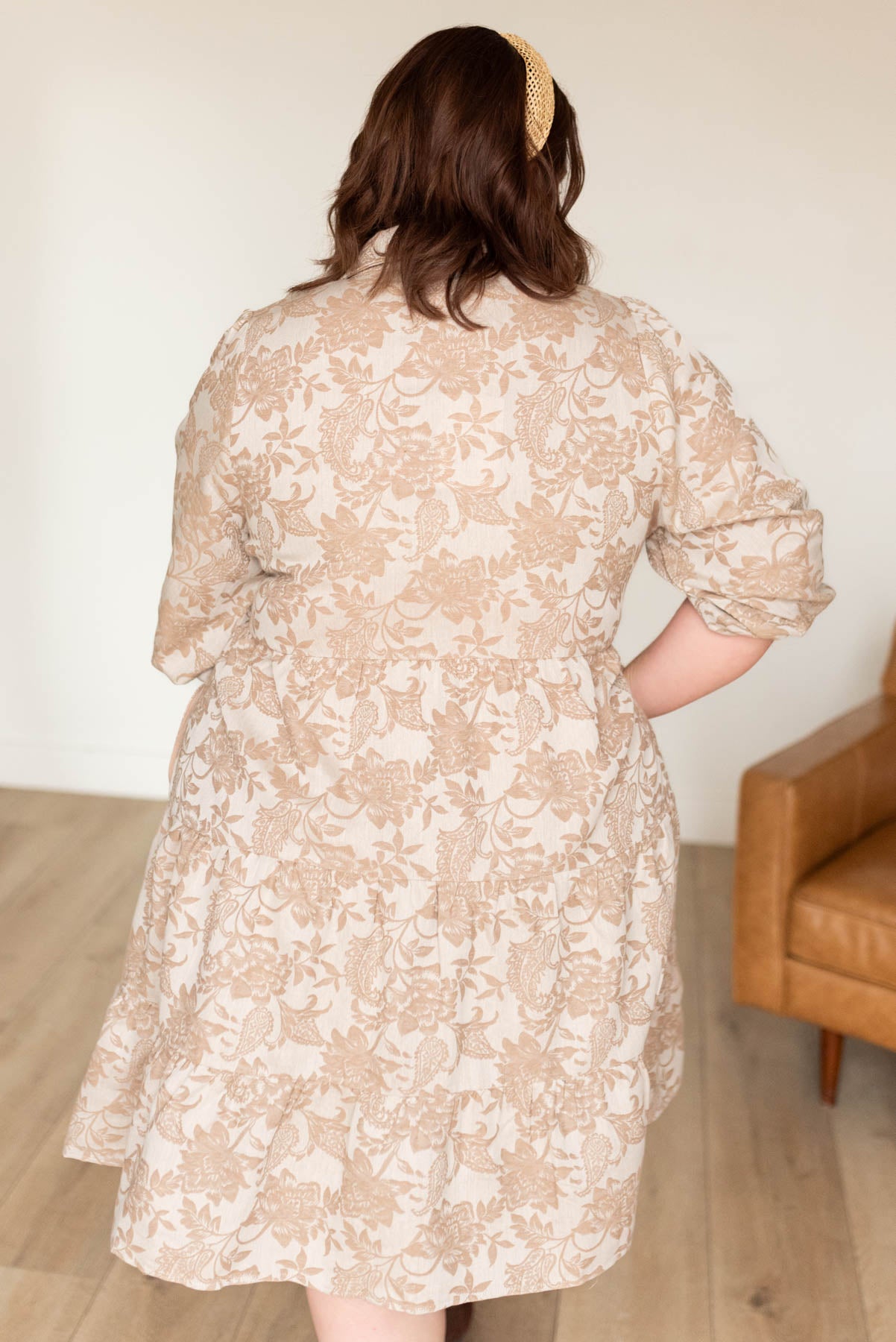 Back view of the plus size taupe floral button down dress