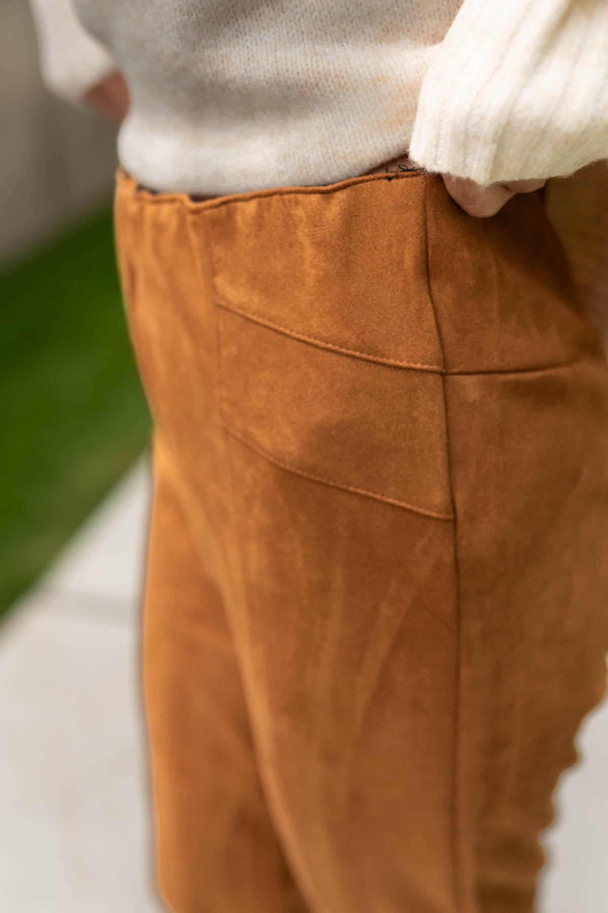 Close up of camel suede leggings