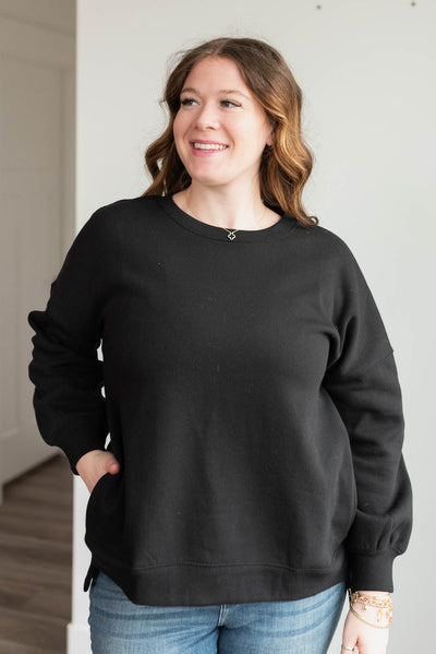 Plus size long sleeve black pocketed sweater with split sides