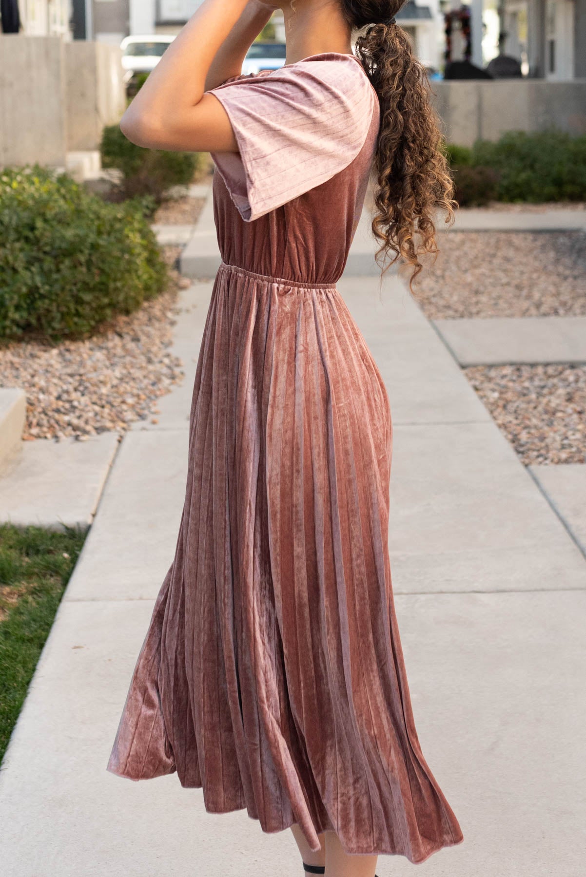 Side view of the dusty rose velvet dress