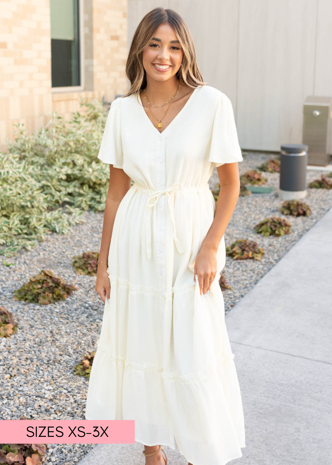 Cream button down dress with a v-neck