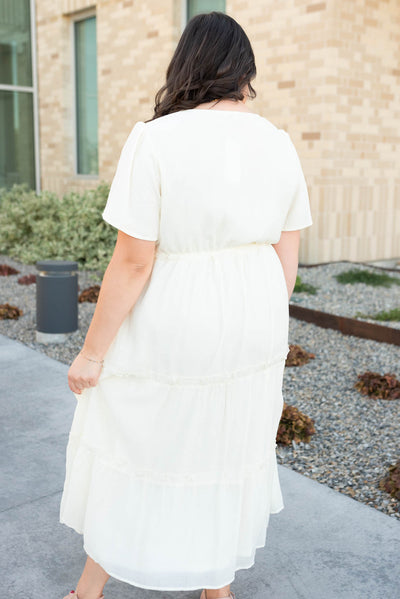 Back view of the cream button down dress in plus size